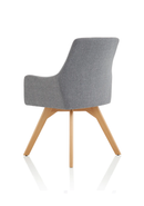 Grey fabric visitor chair with wooden legs and modern design by Dynamic, shown from a side angle.