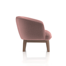 Modern Lulu Accent Chair by Dynamic with plush fabric upholstery and sleek wooden legs, ideal for living rooms or bedrooms.