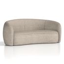 Curved Phoebe sofa by Dynamic with plush cushions and modern design, shown in a stylish living room setting.