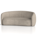 Dynamic Phoebe curved sofa with plush cushions and modern design, shown in a cozy living room setting.