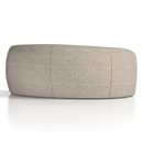 Dynamic Phoebe curved sofa with plush fabric and modern design, featuring a sleek, rounded shape and comfortable seating.