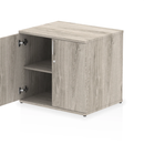 Grey oak Impulse Desk High Cupboard by Dynamic, featuring a modern storage cabinet with multiple compartments and sleek design.