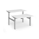 Dams Elev8 Luxe sit-stand back-to-back desks with white 1200mm desktops, ergonomic design for flexible workspace setup.