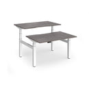 Dams Elev8 Luxe sit-stand back-to-back desks with 1200mm width, featuring sleek white surfaces and modern ergonomic design.