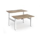 Dams Elev8 Luxe sit-stand back-to-back desks with 1200mm width, featuring a sleek white finish and adjustable height for ergonomic workspace.