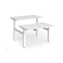Dams Elev8 Luxe sit-stand back-to-back desks with 1200mm width, featuring white tabletops and sturdy metal frames.