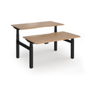 Dams Elev8 Luxe back-to-back sit-stand desks with 1400mm width, featuring adjustable height and modern office design.