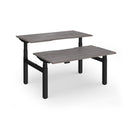 Dams Elev8 Luxe sit-stand back-to-back desks with 1400mm width, featuring sleek black frames and adjustable height settings.