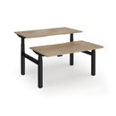Dams Elev8 Luxe sit-stand back-to-back desks with 1400mm width, black finish, and modern ergonomic design.