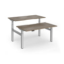 Dams Elev8 Luxe sit-stand back-to-back desks with 1400mm width, featuring sleek workspace and adjustable height for ergonomic comfort.