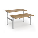 Dams Elev8 Luxe sit-stand back-to-back desks with 1400mm width, featuring adjustable height and modern black finish.