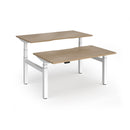 Dams Elev8 Luxe sit-stand back-to-back desks in white, 1400mm width, showing adjustable height and modern office workspace.