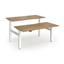 Dams Elev8 Luxe sit-stand back-to-back desks, 1600mm wide, with white surfaces and adjustable height for ergonomic workspace.