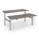 Dams Elev8 Luxe 1800mm sit-stand back-to-back desks with adjustable height and modern design in a workspace setting.