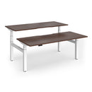 Dams Elev8 Luxe 1800mm sit-stand back-to-back desks with white tabletop and sturdy metal frames in a modern office setting