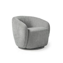 Dams Grace single swivel club chair with plush fabric upholstery and wooden base, shown in a cozy lounge setting.
