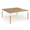 Dams Connex Plus wooden goal-post back-to-back desk in oak, featuring a sturdy back panel and modern office design.