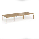 Dams Connex Plus wooden goal-post triple back-to-back desk in oak with sleek, modern design and natural wood finish.