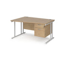 Dams Maestro 25 Wave Desk with Kendal Oak finish, featuring cantilever leg and fixed 2-drawer pedestal on a clean office setting.