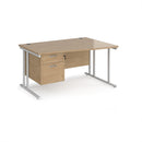 Dams Maestro 25 Wave Desk with Kendal Oak finish, cantilever leg, and fixed 2-drawer pedestal on white background.