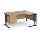 Dams Maestro 25 ergonomic desk with Kendal Oak finish, cantilever legs, and fixed 2-drawer pedestal visible in modern office setting.