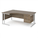 Dams Maestro 25 ergonomic desk with Nebraska Oak finish, cantilever legs, and fixed 2-drawer pedestal on a clean office floor