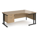 Dams Maestro 25 ergonomic desk with Kendal Oak finish, cantilever legs, and fixed two-drawer pedestal shown in the image.