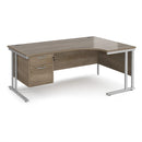 Dams Maestro 25 ergonomic desk with Nebraska Oak finish, cantilever legs, and fixed 2-drawer pedestal in a modern office setting.