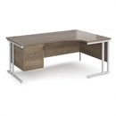 Dams Maestro 25 ergonomic desk with Nebraska Oak finish, cantilever legs, and fixed 2-drawer pedestal on a white background.