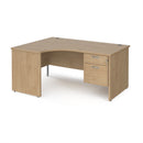 Dams Maestro 25 ergonomic desk with Kendal Oak finish, panel end leg, and fixed two-drawer pedestal on a wood office workspace
