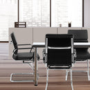 Nautilus Designs Avanti bonded leather medium back visitor armchair with plush back cushions in a stylish living room setting.