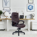 Nautilus Designs Greenwich high back leather-effect executive chair with contoured design and supportive backrest in a lifestyle setting.