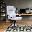Nautilus Designs Westminster high back leather executive chair with integral headrest and chrome base, shown in a stylish office setting.