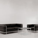 Black Belmont contemporary leather-faced 3-seater reception sofa with stainless steel frame and integrated leg supports, Nautilus Designs.