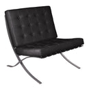 Black Valencia contemporary oversized leather reception chair with classic button design by Nautilus Designs.