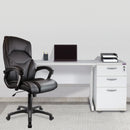 Black Wellington High Back Leather Effect Executive Chair by Nautilus Designs, shown in a stylish office setting.