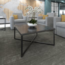 Large square Dams Siano coffee table with black steel frame and Lotus wood top, showcasing a modern and stylish living room centerpiece.