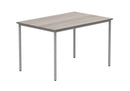 Core multi-purpose table in Alaskan Grey Oak finish by TC, showcasing a sleek tabletop with sturdy legs for versatile use.