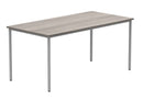 Front view of TC Core multi-purpose table in Alaskan grey oak finish with sturdy wooden legs and spacious tabletop.
