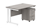 Core Twin upright rectangular desk in Alaskan Grey Oak with 3-drawer pedestal, TC brand, shown from front angle.