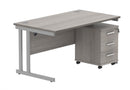Core Twin upright rectangular desk bundle with 3-drawer pedestal in Alaskan Grey Oak by TC, showing the front view of the desk and storage units.