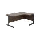 Front view of TC Office single upright radial desk in dark walnut finish, showcasing its modern design and smooth surface.