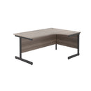 Front view of TC Office Single Upright Radial Desk in grey oak finish, showcasing its sleek, modern design and rounded edges.