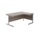 Front view of the TC Office Single Upright Radial Desk in grey oak finish, showcasing the modern office desk design.