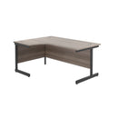 Front view of TC Office Single Upright Radial Desk in Grey Oak finish, showcasing the desk's curved design and wood grain surface.
