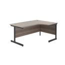Front view of the TC Office Single Upright Radial Desk in grey oak finish, showcasing its modern design and spacious workspace.