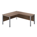 TC Goal Post Return Desk in Walnut, featuring a sleek wood finish and modern design with a spacious work surface.