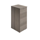 Essentials wooden filing cabinet in grey oak finish by TC, featuring multiple drawers for organized office storage.
