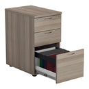 Front view of TC Essentials Desk High Pedestal in Grey Oak with open filing drawers for organized workspace storage.