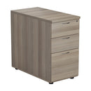 Essentials Desk High Pedestal in Grey Oak by TC, featuring multiple drawers for office storage and organization.